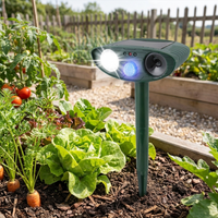 Ultrasonic rabbit repeller staked in a garden lifestyle setting