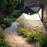 Outdoor solar light illuminating a garden pathway at dusk