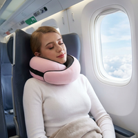 Person wearing a travel neck pillow relaxing at an airport