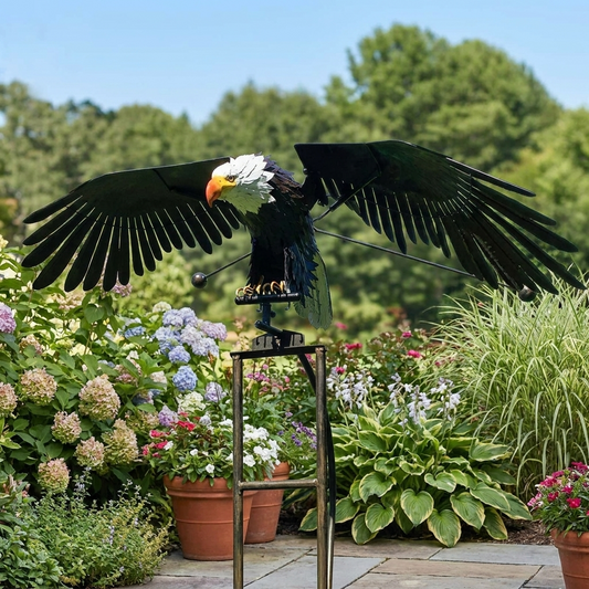 Garden art bird decoration displayed on a patio among plants