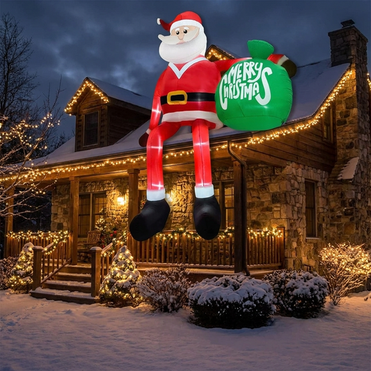 Giant LED climbing Santa inflatable Christmas decoration displayed on a house at night