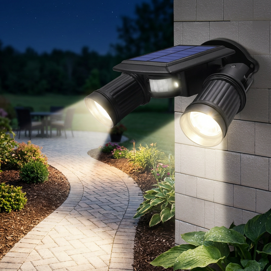 Motion sensor solar LED light illuminating a backyard pathway at night