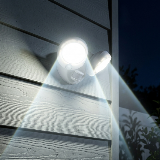 Weatherproof LED outdoor light with motion sensor illuminating a house exterior wall at night