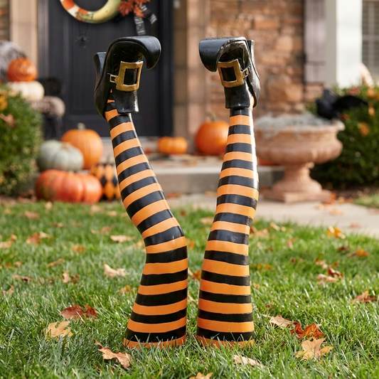 Witch leg stakes Halloween yard decoration in a front yard lawn