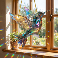 Hummingbird suncatcher hanging in a sunlit window