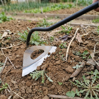 All steel hollow hoe hoeing soil in a garden