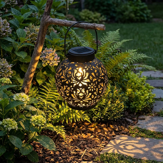 Solar pendant light mounted outdoors in a garden at dusk
