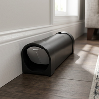 Humane mouse trap placed along a home baseboard