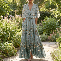 Green long dress worn outdoors in a garden
