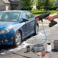 High pressure spray water gun washing a car outdoors