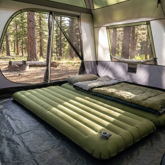 Inflatable camping mattress set up inside a tent