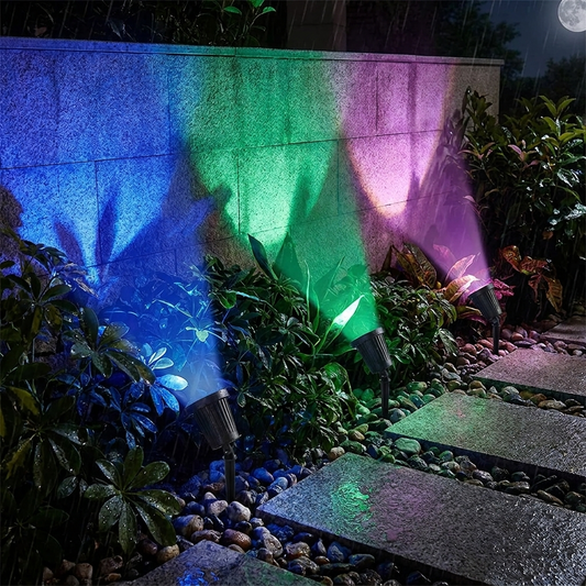 Solar landscape spot light illuminating a garden at night