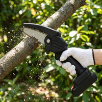 Mini chainsaw cutting a tree branch outdoors