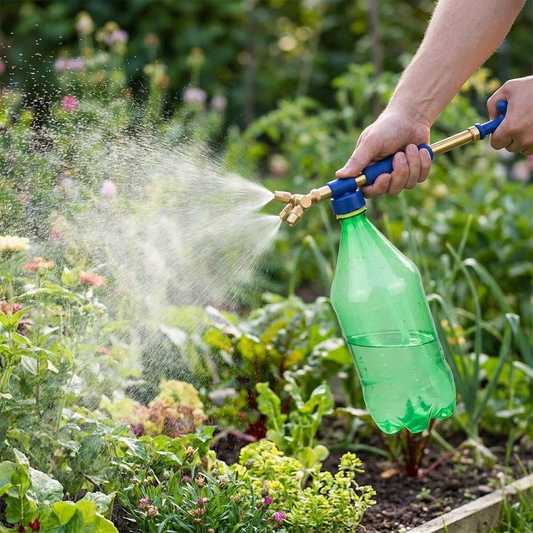 Garden pump sprayer in use spraying plants